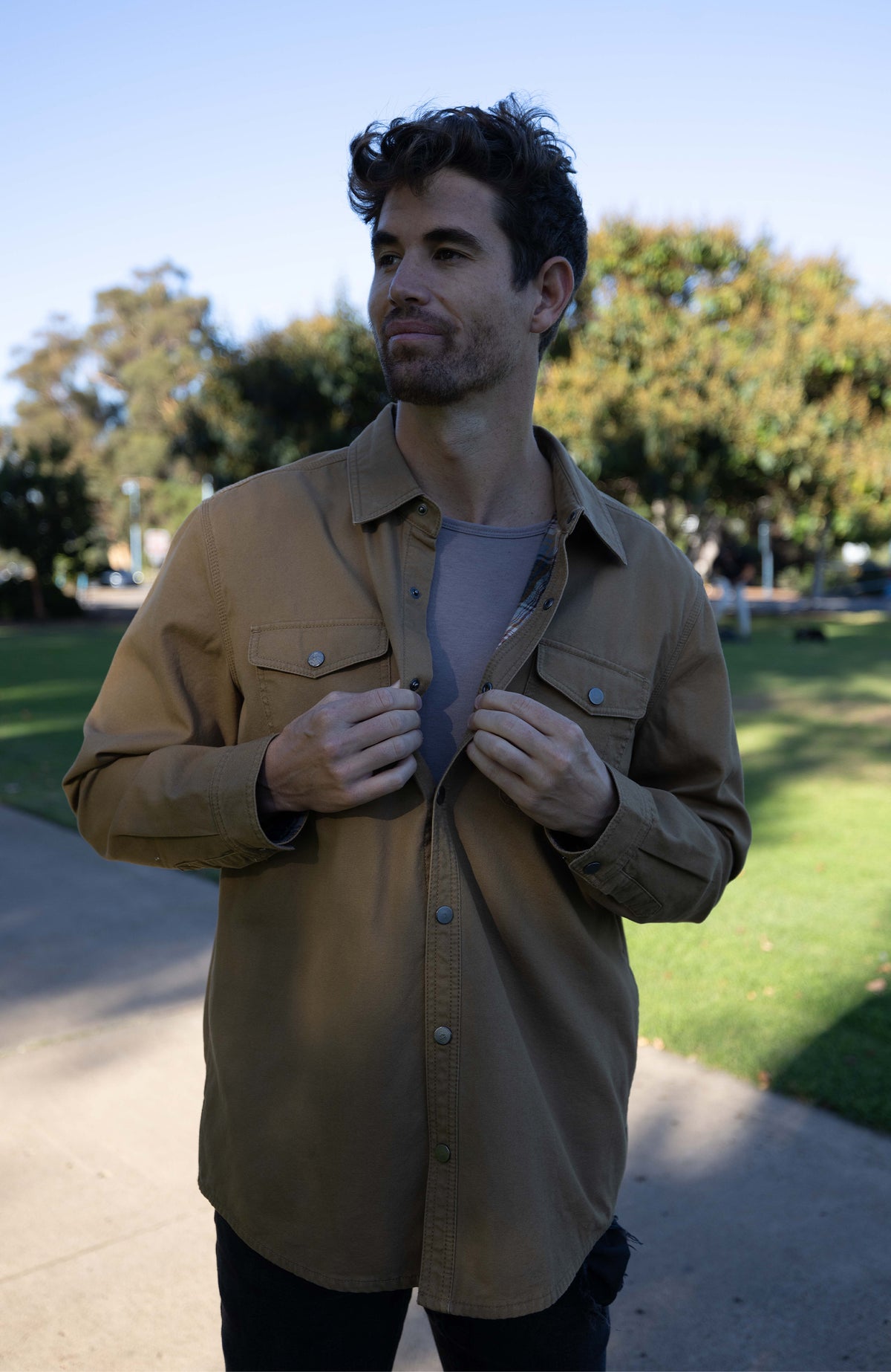 camel canvas shirt jacket for men. Lifestyle image from influencers